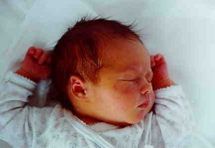 Christoper sleeps in pram, two days old